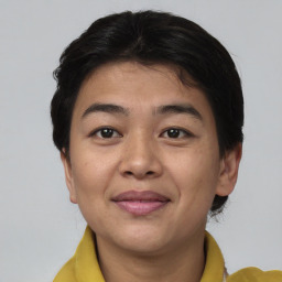 Joyful asian young-adult female with short  brown hair and brown eyes