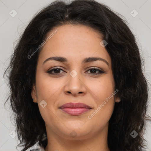 Joyful latino adult female with medium  brown hair and brown eyes