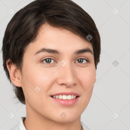 Joyful white young-adult female with short  brown hair and brown eyes