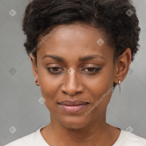 Joyful black young-adult female with short  brown hair and brown eyes