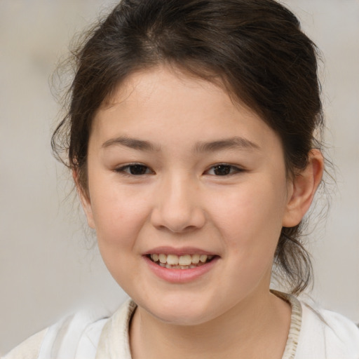Joyful white child female with medium  brown hair and brown eyes