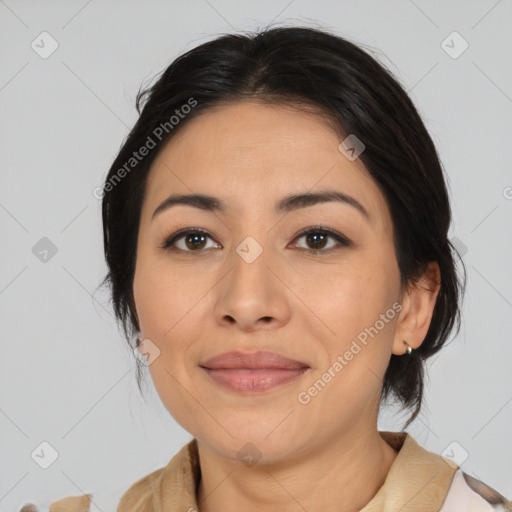 Joyful latino young-adult female with medium  brown hair and brown eyes