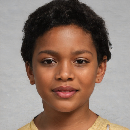 Joyful black child female with short  brown hair and brown eyes