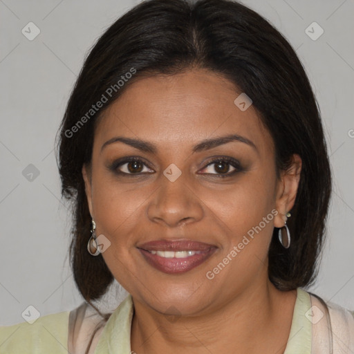 Joyful black young-adult female with medium  brown hair and brown eyes