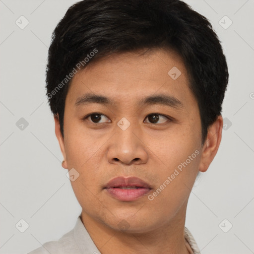 Joyful asian young-adult male with short  black hair and brown eyes
