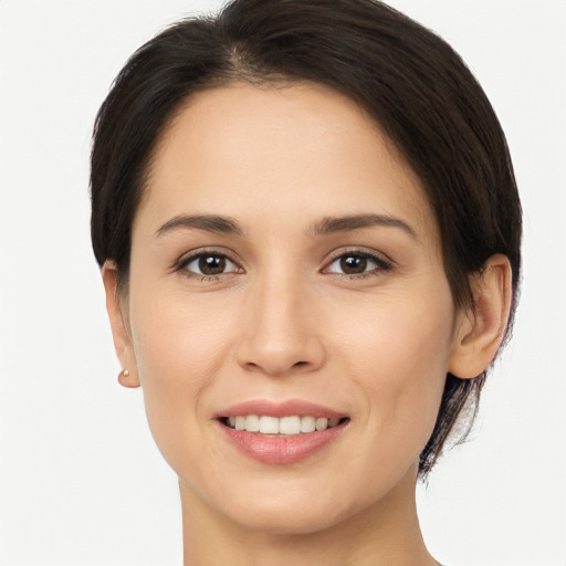 Joyful white young-adult female with medium  brown hair and brown eyes