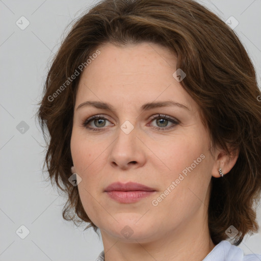 Joyful white young-adult female with medium  brown hair and green eyes