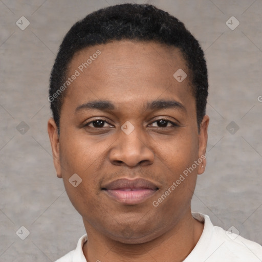 Joyful black young-adult male with short  black hair and brown eyes