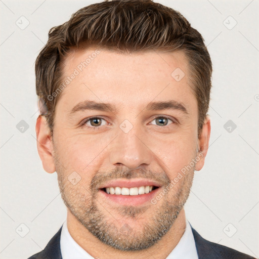 Joyful white young-adult male with short  brown hair and grey eyes