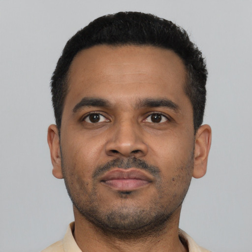 Neutral latino young-adult male with short  black hair and brown eyes