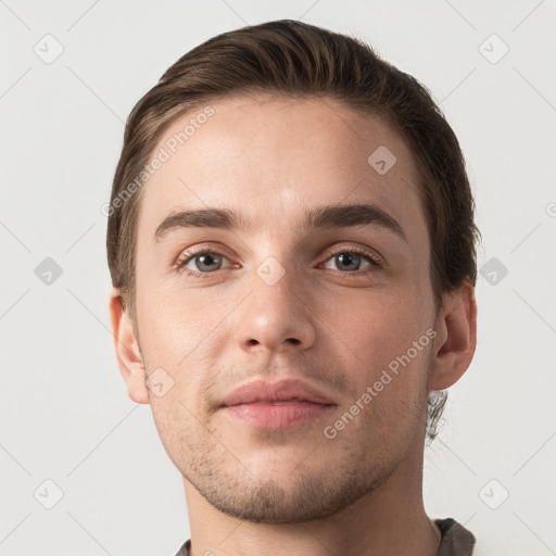 Neutral white young-adult male with short  brown hair and grey eyes