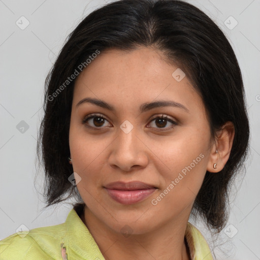 Joyful latino young-adult female with medium  brown hair and brown eyes