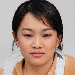 Neutral asian young-adult female with medium  brown hair and brown eyes