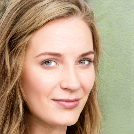 Joyful white young-adult female with long  brown hair and blue eyes