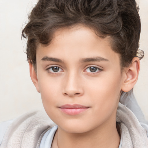 Joyful white child female with short  brown hair and brown eyes