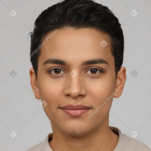 Joyful latino young-adult male with short  black hair and brown eyes