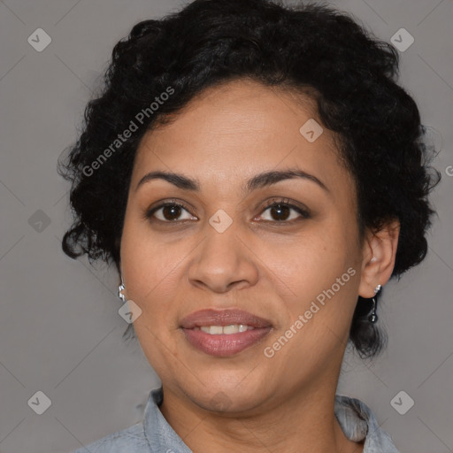 Joyful latino adult female with medium  black hair and brown eyes