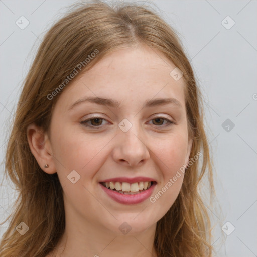 Joyful white young-adult female with long  brown hair and blue eyes