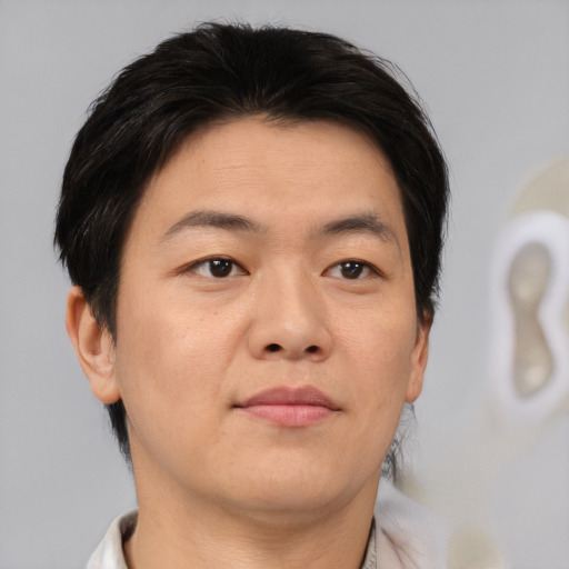 Neutral asian adult male with short  brown hair and brown eyes