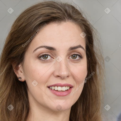 Joyful white young-adult female with long  brown hair and green eyes