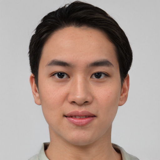 Joyful asian young-adult male with short  brown hair and brown eyes