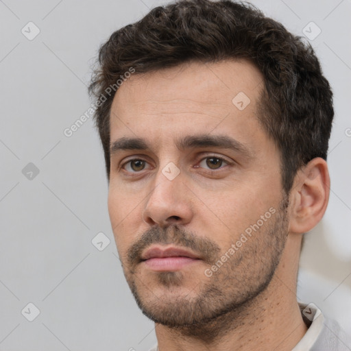 Neutral white young-adult male with short  brown hair and brown eyes