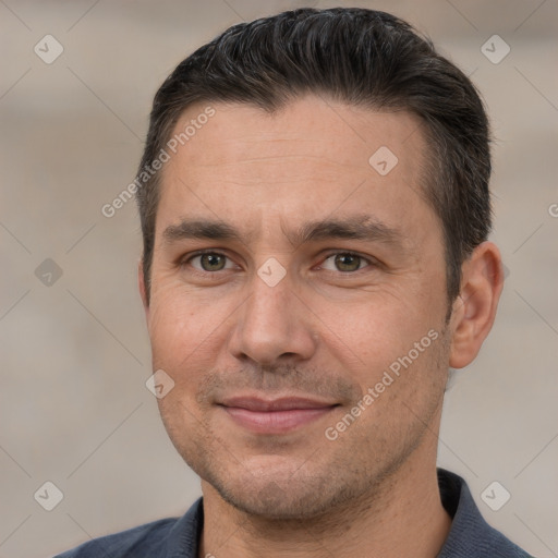 Joyful white adult male with short  brown hair and brown eyes