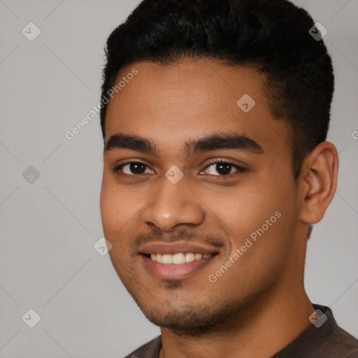 Joyful latino young-adult male with short  black hair and brown eyes