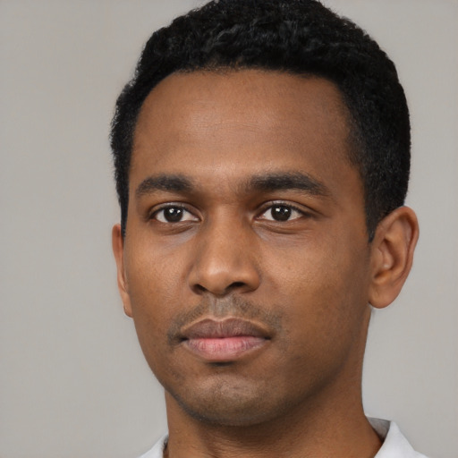 Neutral black young-adult male with short  black hair and brown eyes