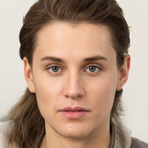 Neutral white young-adult female with medium  brown hair and brown eyes