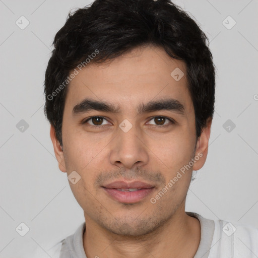 Joyful white young-adult male with short  black hair and brown eyes