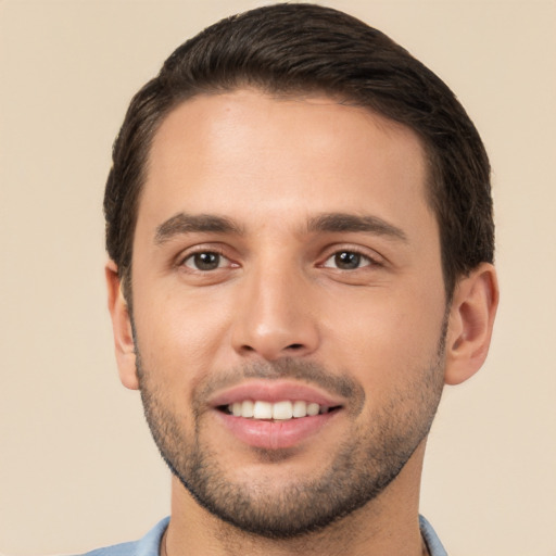 Joyful white young-adult male with short  brown hair and brown eyes