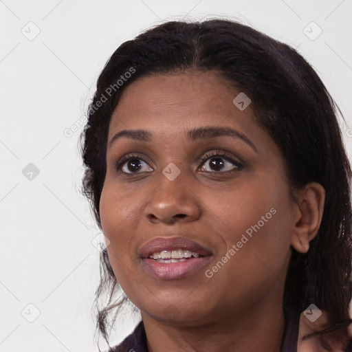 Joyful black young-adult female with medium  brown hair and brown eyes