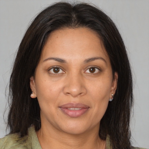 Joyful white adult female with medium  brown hair and brown eyes