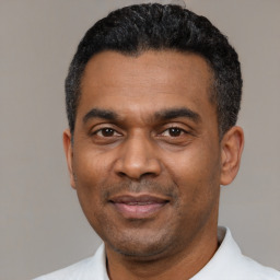 Neutral latino adult male with short  black hair and brown eyes