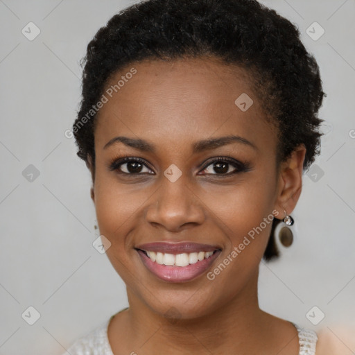 Joyful black young-adult female with short  brown hair and brown eyes