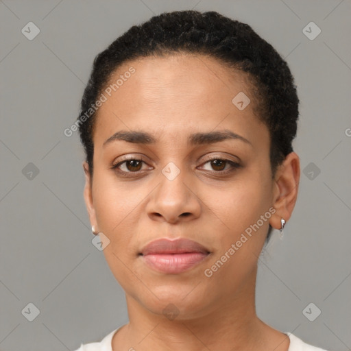 Joyful black young-adult female with short  brown hair and brown eyes