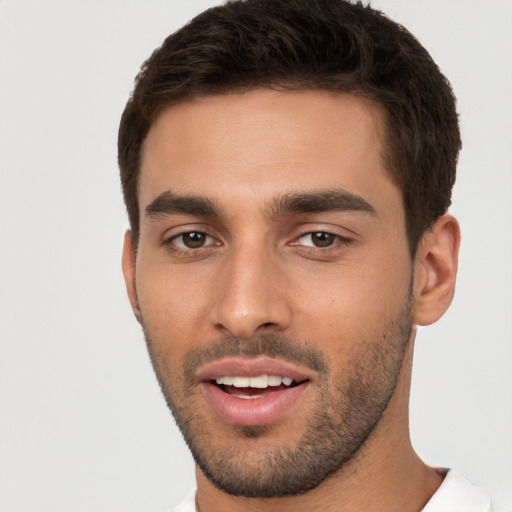 Joyful white young-adult male with short  brown hair and brown eyes