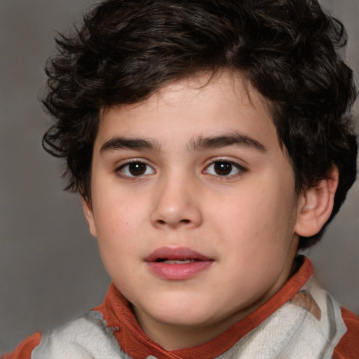 Joyful white child male with short  brown hair and brown eyes