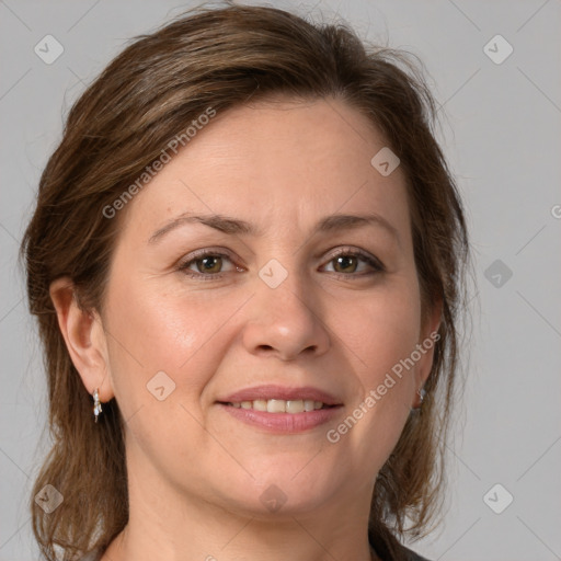 Joyful white adult female with medium  brown hair and grey eyes