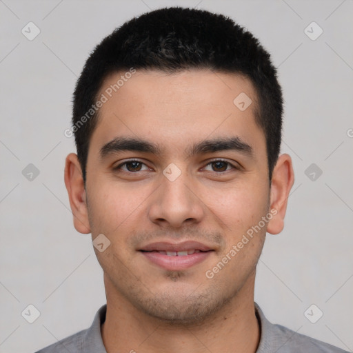 Joyful latino young-adult male with short  black hair and brown eyes