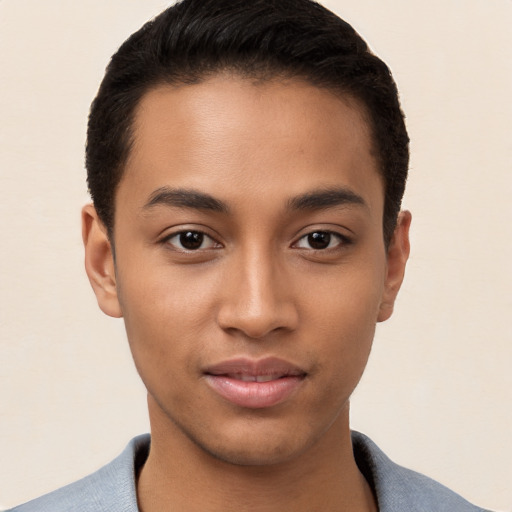 Joyful white young-adult male with short  black hair and brown eyes