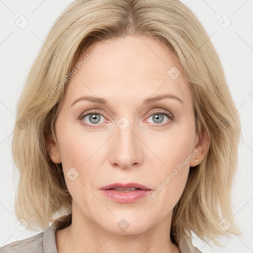 Joyful white young-adult female with medium  brown hair and blue eyes