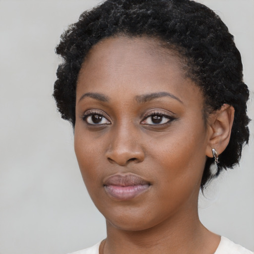 Neutral black young-adult female with short  black hair and brown eyes