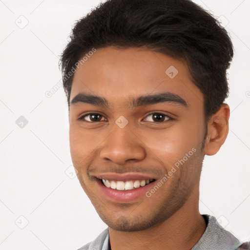 Joyful latino young-adult male with short  brown hair and brown eyes