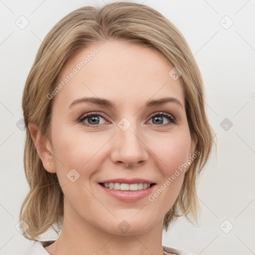 Joyful white young-adult female with medium  brown hair and blue eyes