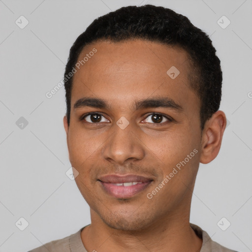 Joyful black young-adult male with short  black hair and brown eyes