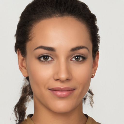 Joyful latino young-adult female with short  brown hair and brown eyes