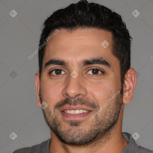 Joyful white young-adult male with short  black hair and brown eyes