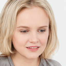 Joyful white child female with long  brown hair and blue eyes